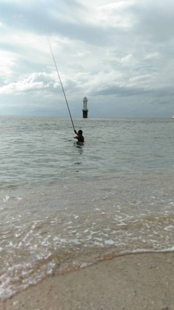 istock Angler on Senggigi Beach 1406096197