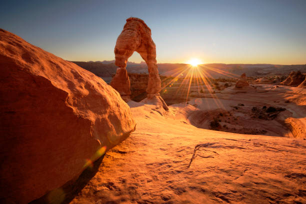 Delicate Arch at Sunset Delicate Arch at Sunset, near Moab Utah delicate arch stock pictures, royalty-free photos & images