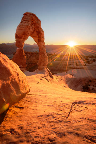 Delicate Arch at Sunset Delicate Arch at Sunset, near Moab Utah arches national park stock pictures, royalty-free photos & images