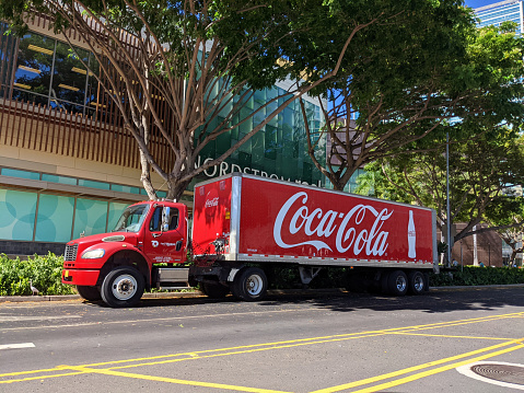 Honolulu - June 30, 2021: Coca-Cola delivery truck parked in front of Nordstrom Rack..