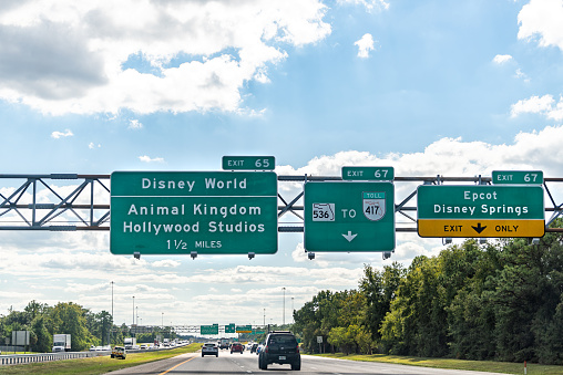 Orlando, USA - October 19, 2021: Highway exit sign for Disney World Epcot at Disney Springs Magic Kingdom and Hollywood Studios themed amusement parks in Florida Lake Buena Vista