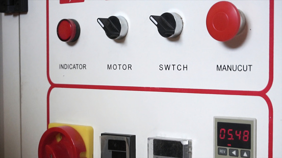 Close-up of white plant equipment control switch panel. Modern automated industrial plant enterprise control panel. . Footage. Concept of automatic machine operation of production.