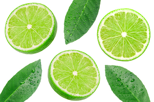 Green lime slices with leaf has water drop pattern isolated on white background.