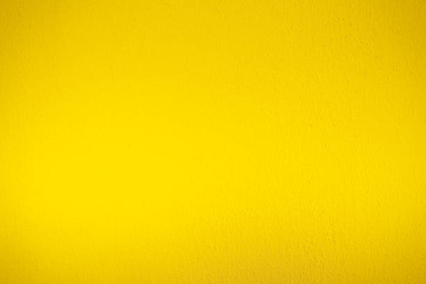 istock Abstract weathered texture stained old stucco light yellow color and aged paint concrete wall background 1406120274