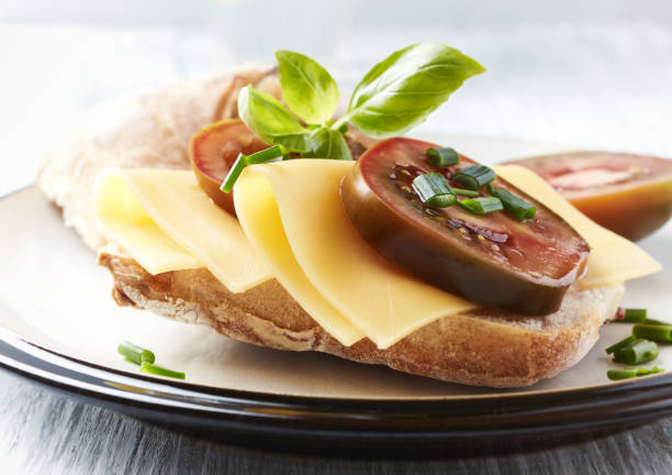 istock Sandwich with cheese and tomatoes. Close up. 1406121228