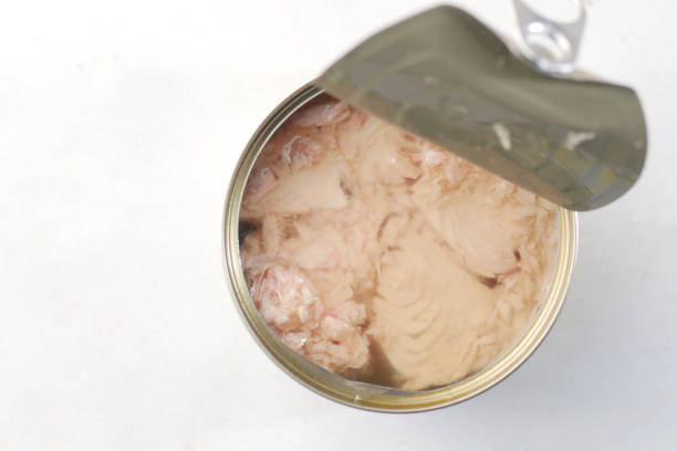 istock canned tuna on wooden on white background 1406124649