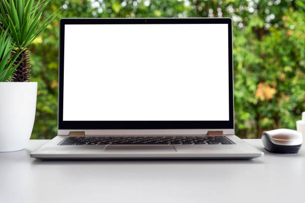 istock Laptop with black white screen of top of table 1406127431