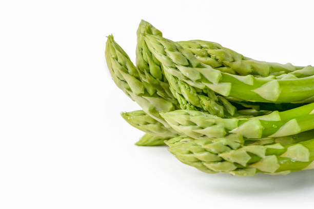 istock Fresh green asparagus on a white isolated background. Green asparagus isolate with shadow on white background. 1406127445