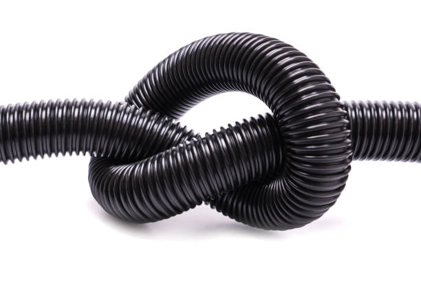 istock Knotted flexible black corrugated vacuum cleaner hose 1406129913