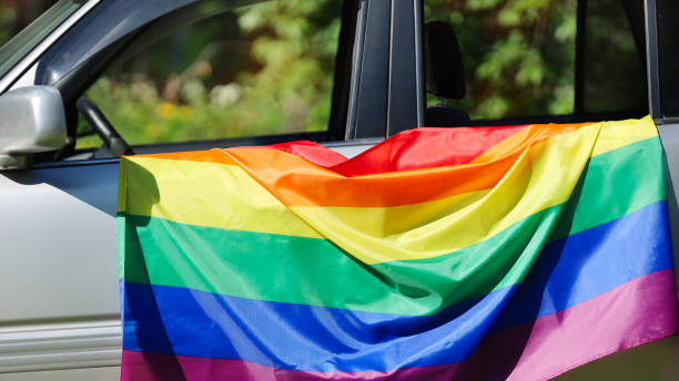 istock Rainbow flag on car. LGBT concept. 1406132044