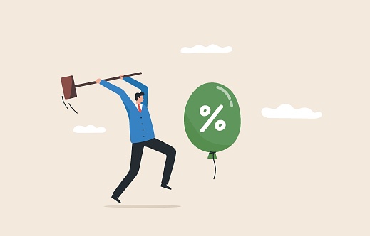 Beat inflation. 
controlling inflation by raising interest rates. economic risk or investment bubble. Businessman trying to hit balloons with a hammer.