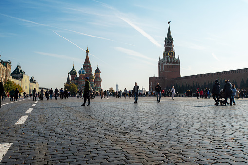 Moscow, Russia - April 7, 2019: Red Square view. The Saint Basil's Cathedral or Cathedral of Vasily the Blessed and Spasskaya or Saviour Tower. Popular touristic public location, sighseeing