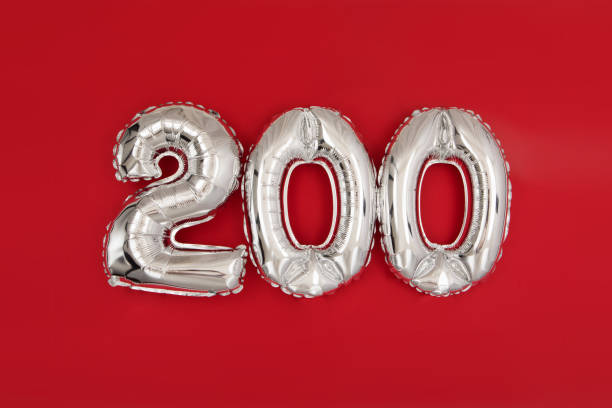 Silver balloon showing number 200 on red background stock photo