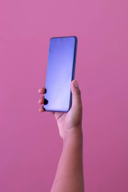 istock selective focus of mobile phone holding by hand. 1406133804