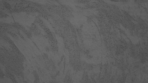istock Anthracite gray grey stone concrete plaster facade wall texture background 1406133930