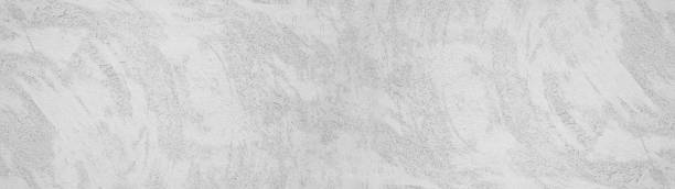 istock White gray grey stone concrete plaster facade wall texture background banner panorama 1406133971