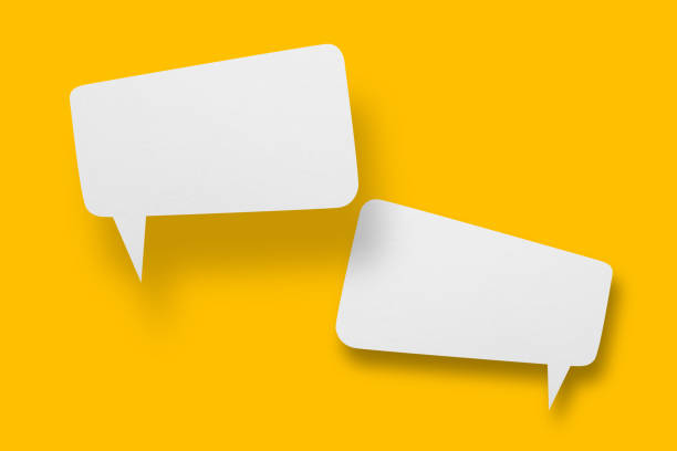 istock White paper in speech bubble shape set against yellow background. 1406134081