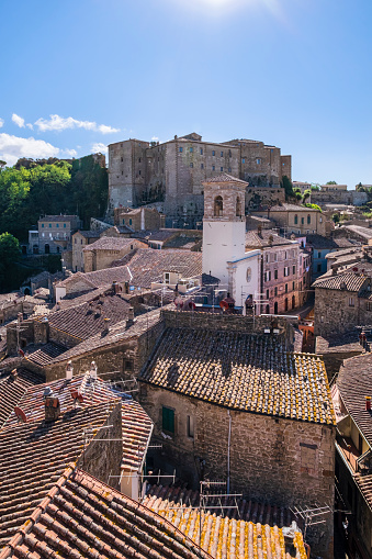 The roofs of the old houses of Sorano and, in background, the imposing bulk of the medieval Fortezza Orsini, seat of the Civic and Archaeological Museum