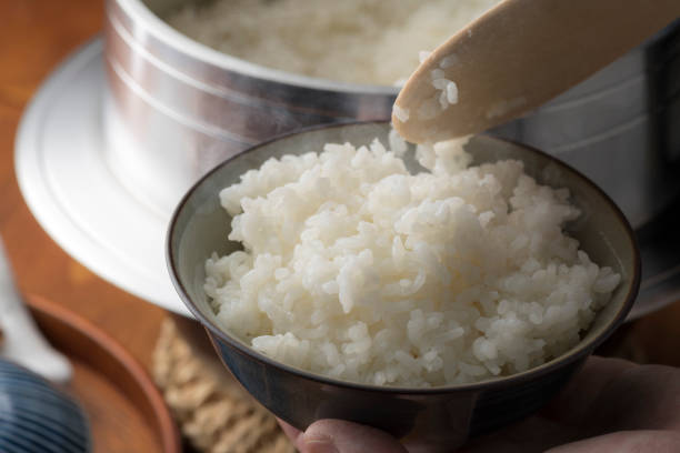 istock Cook rice in a traditional Japanese rice cooker, Hagama. 1406135843