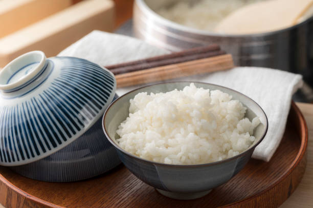 Cook rice in a traditional Japanese rice cooker, Hagama. Cook rice in a traditional Japanese rice cooker, Hagama. washoku stock pictures, royalty-free photos & images