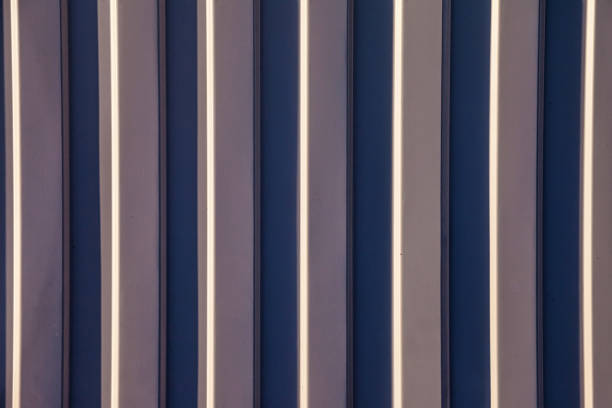 Close-up background vertical lines full frame. Gray steel wall abstract textured. Art concept and style for design, textures and wallpaper. Copy space