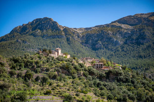 istock Spanish village on a green mountain. 1406136710