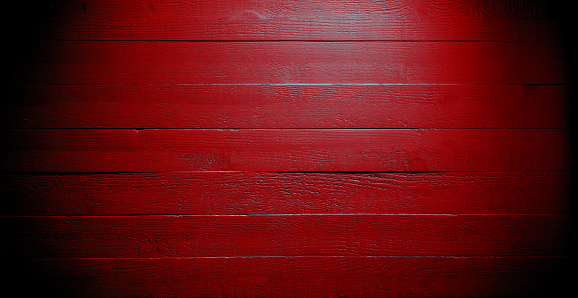 Rustic red wood planks background. Red wooden slats on exterior wall
