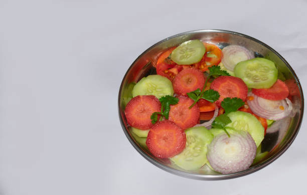 istock Green salad with tomato and fresh vegetables isolated on white background 2/29 image series 1406140840