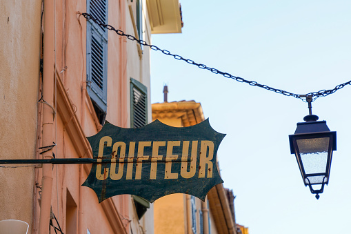 Coiffeur french text sign on facade classic vintage hairdresser shop in france street
