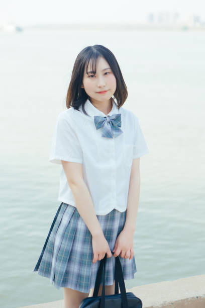 istock Students in uniform who travel by the sea on vacation 1406143182
