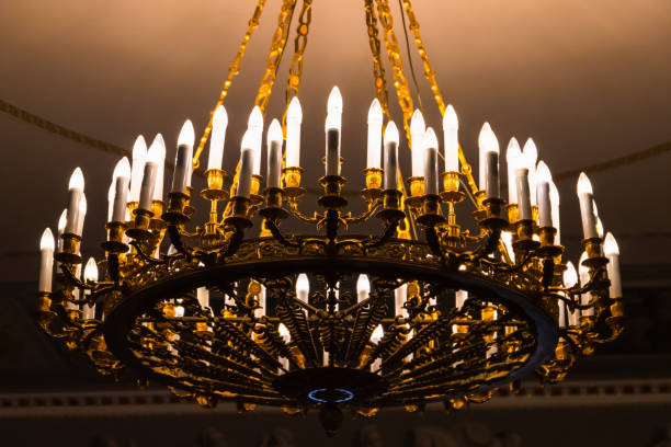 istock Round vintage chandelier with candle lights 1406144578