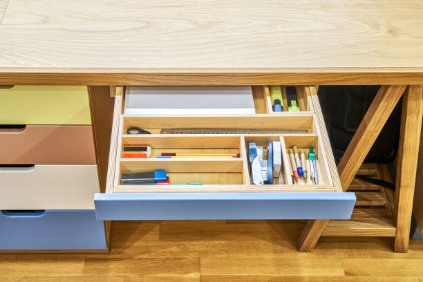 istock Sawhorse desk with cabinet and multi-colored drawers 1406147388
