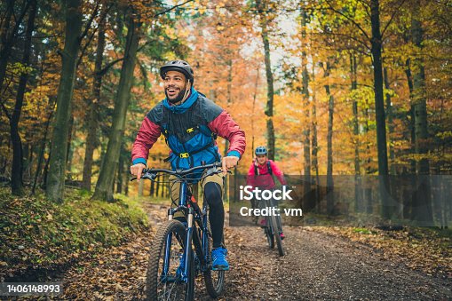 istock Smiling young black man enjoying sport with friends in nature 1406148993