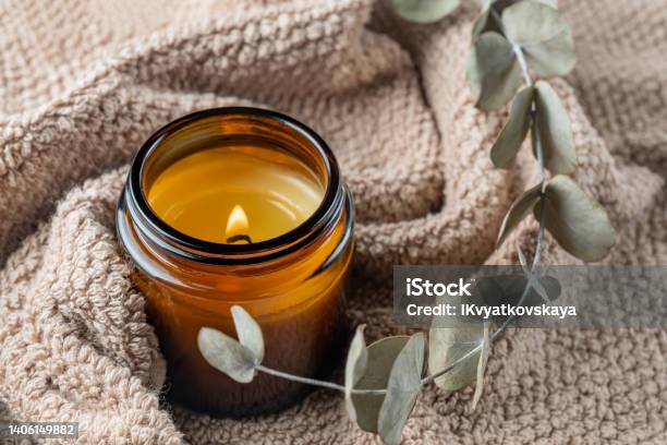 Aroma Candle In Brown Glass Jar Scented Handmade Candle Soy Candles Are Burning In A Jar Aromatherapy And Relax In Spa And Home Still Life Fire In Brown Jar Stock Photo - Download Image Now