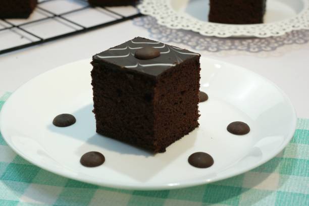 istock Chocolate brownie cake slices on a white plate 1406150118