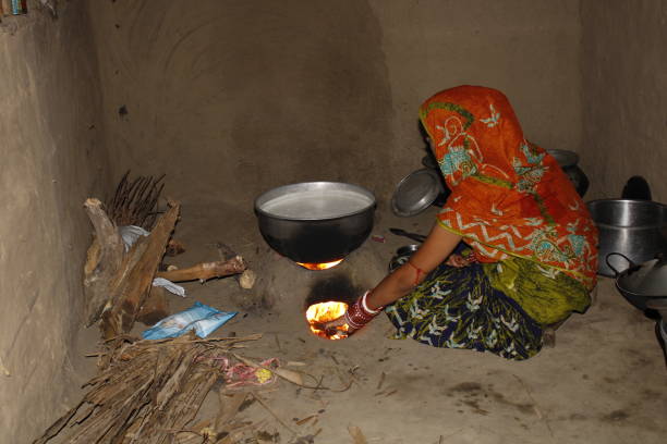 istock A Indian Woman Making Paneer or Cheese At Her Home With Traditional Method Using Mud Stove. 1406151246