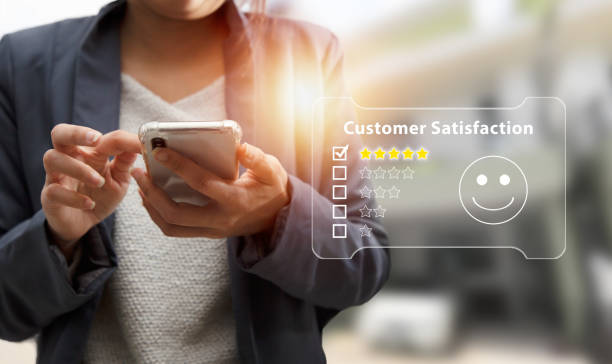 istock Businesswoman is using smartphone and review with excellent performance. 1406153686
