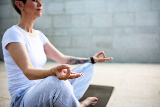 istock Mature caucasian woman meditating 1406153710