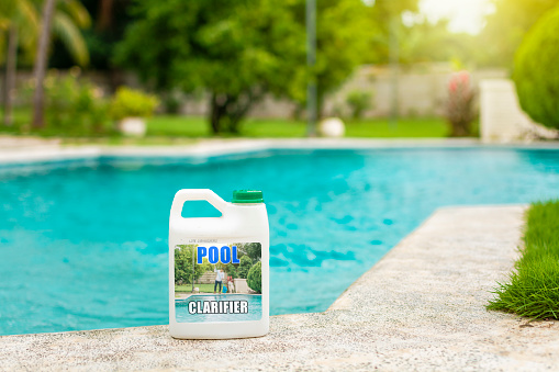 Concept of chemical products to purify swimming pools. Swimming pool clarifier, pool purification and cleaning tool. Algaecide product to clarify home swimming pools