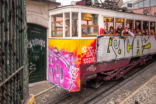 Lisbon, Portugal - October 31, 2022: colorful tram in the streets of Lisbon