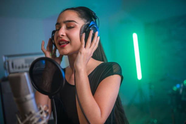 istock Young Asian Beautiful Woman Singing in Recording Studio 1406156437