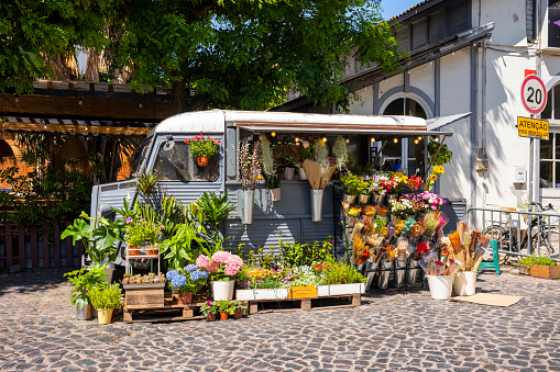 Lissabon, Portugal - May 27, 2022: Beautiful vintage flower van at the LX factory site in Lisbon in summer.