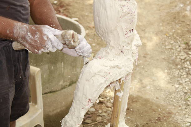 A Skilled Artisan Creates Plaster Modern Art Abstract Sculpture.