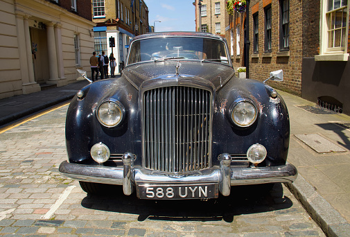 London, UK - 06.12.2018: Front view of a vintage Bentley car parked on the street, East London.