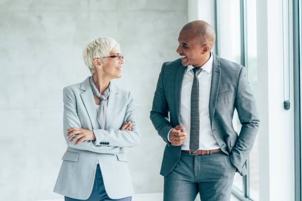 istock Two cheerful business people 1406160400