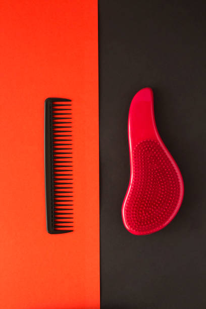 istock Black and red combs on the colored background.Top view. Close-up. 1406160438