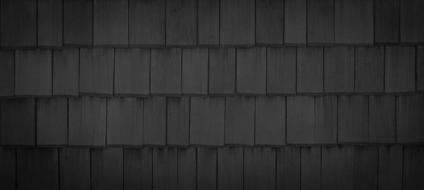 istock Old black anthracite gray grey dark rustic wooden shingles wall texture - wood background panorama banner 1406161410
