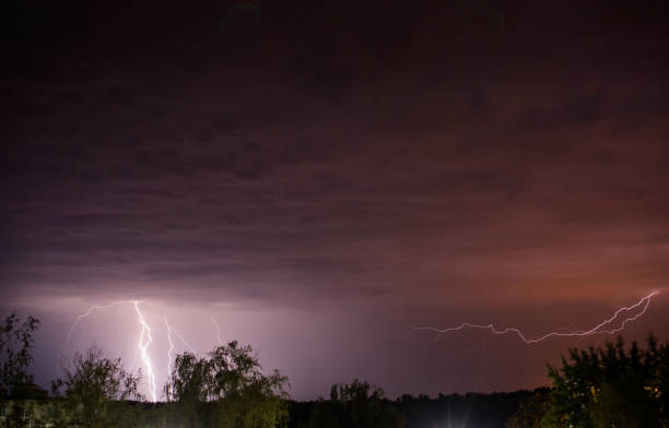 istock Flash of lightning. Natural disaster. Night dark dramatic sky. Scary cloud. Dangerous heaven. Storm weather. Summer rain. Nature background. Rainy season. Mystical landscape 1406162657