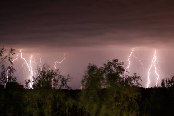 flash of lightning. natural disaster. night dark dramatic sky. scary cloud. dangerous heaven. storm weather. summer rain. nature background. rainy season. mystical landscape - summer landscape flash imagens e fotografias de stock