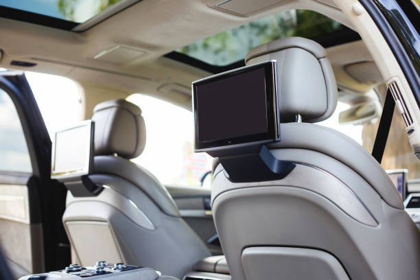 Entertainment system for rear passengers in a car with two monitors. stock photo